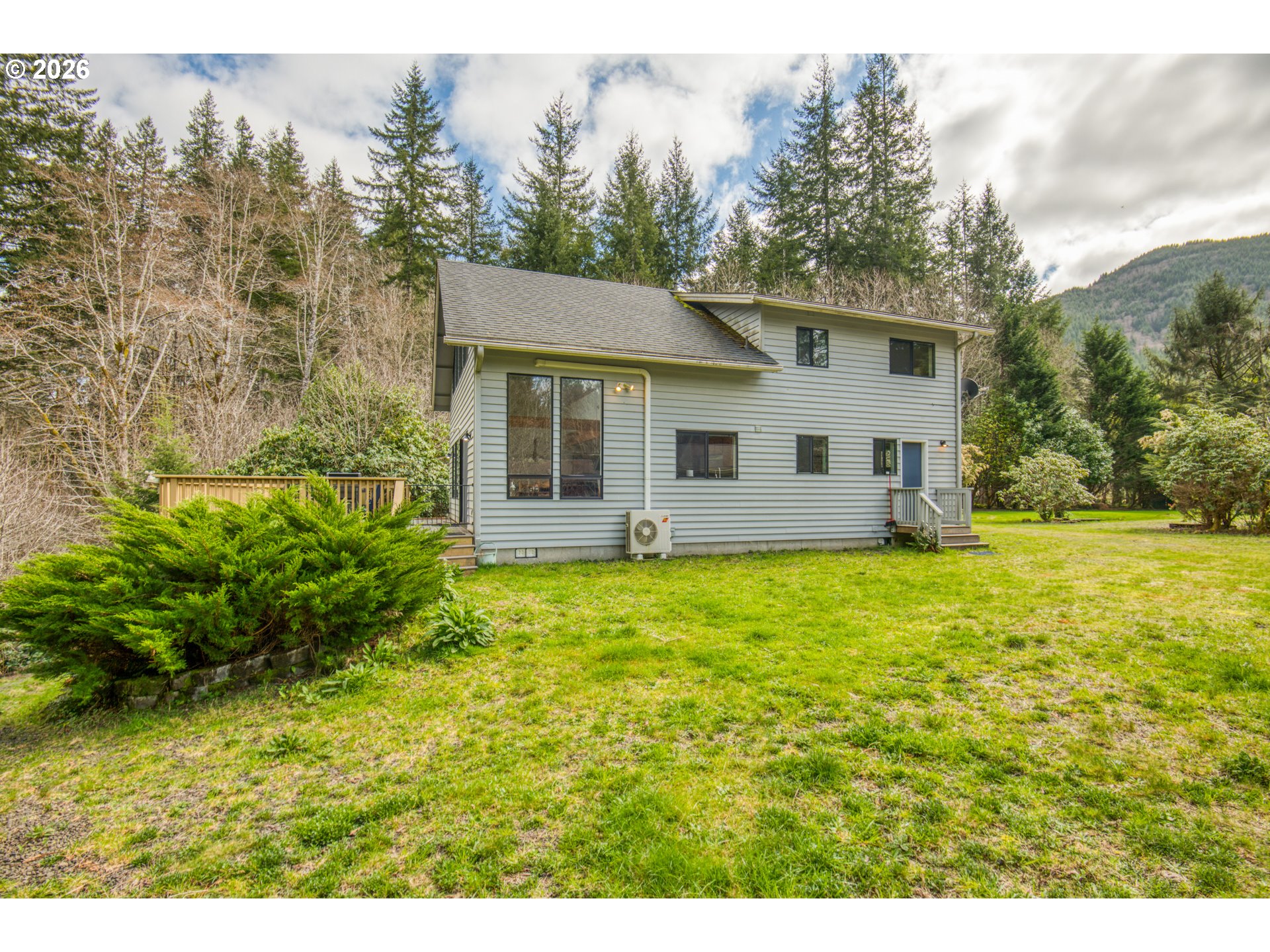 78488 Highway 53 Nehalem, OR 97131 - Photo 6 of 40 a view of a house with backyard and garden