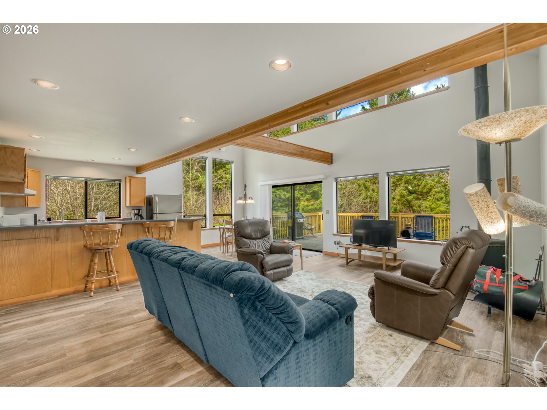 78488 Highway 53 Nehalem, OR 97131 - Photo 7 of 40 a living room with furniture and a large window