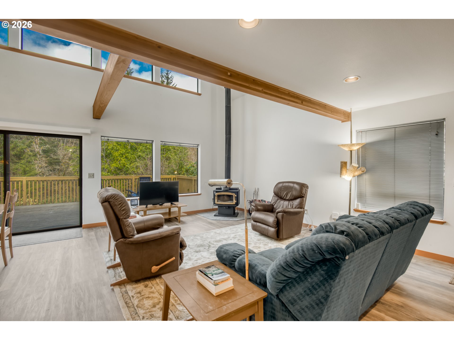 78488 Highway 53 Nehalem, OR 97131 - Photo 8 of 40 a living room with furniture and a large window