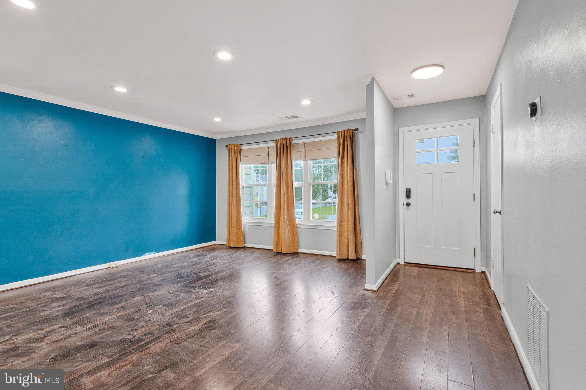 1675 Ridgely Court, Unit 182 Crofton, MD 21114 - Photo 19 of 47 a view of an empty room with wooden floor and closet