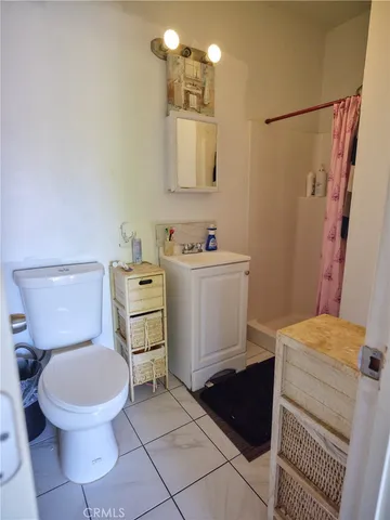 a bathroom with a toilet a sink and bathtub