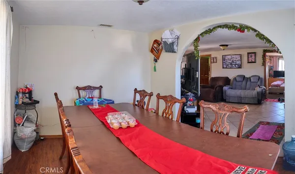 a view of livingroom and dining room with furniture