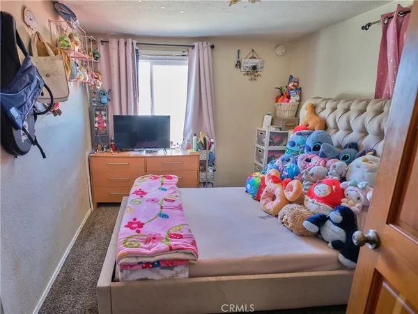 a bedroom with toys and a couch