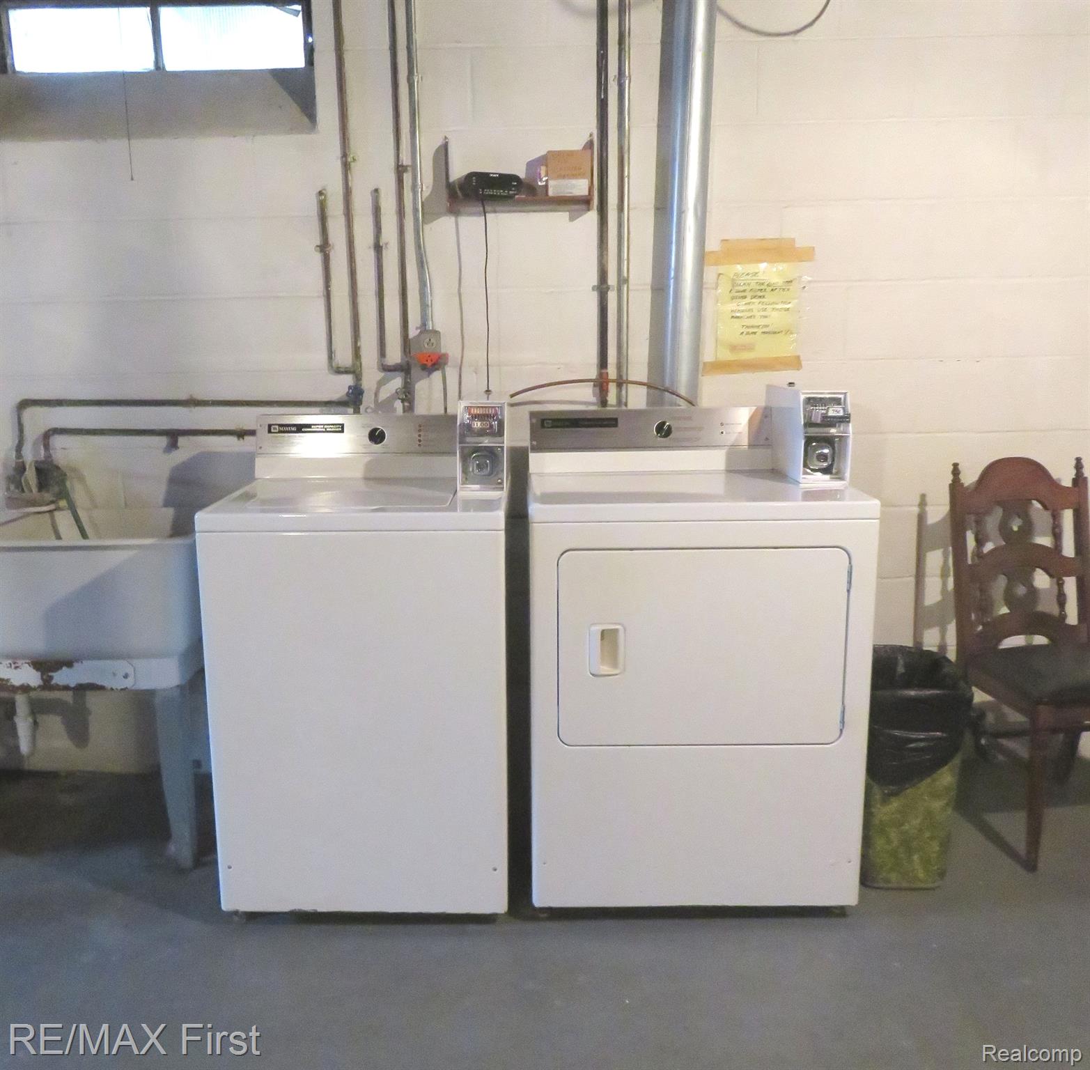 15219 East 9 Mile Road, Unit 1A Eastpointe, MI 48021 - Photo 16 of 16 COIN OPERATED LAUNDRY IN BASEMENT