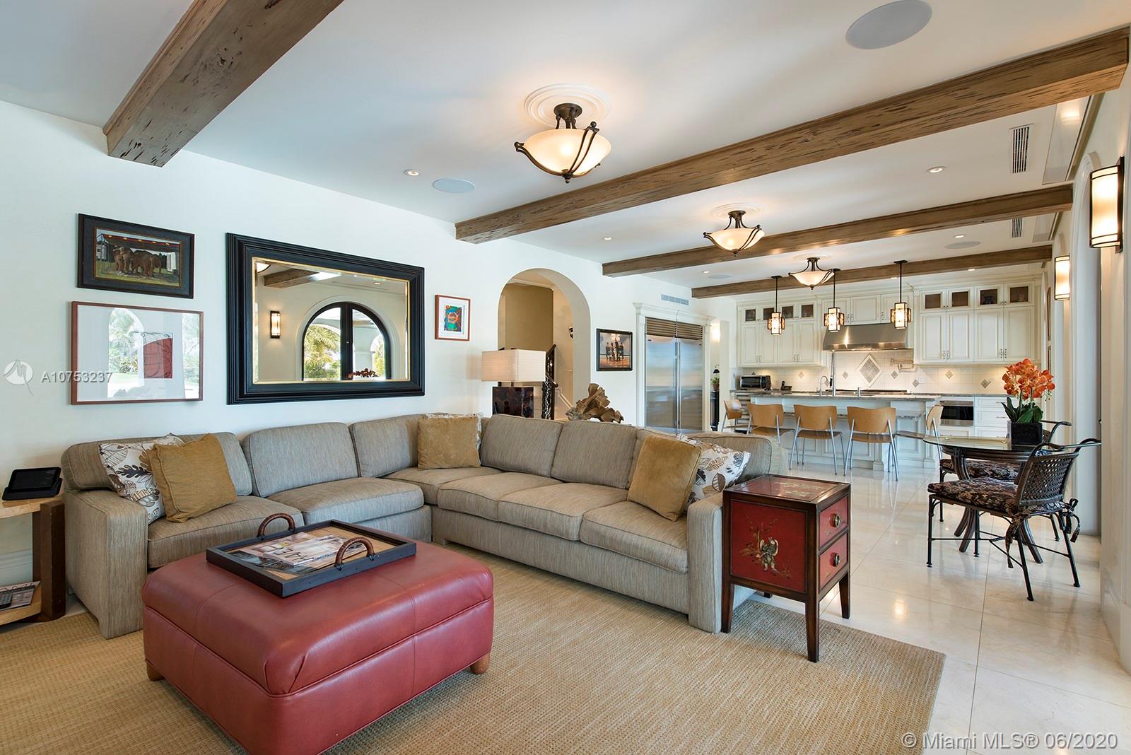 7825 Atlantic Way Miami Beach, FL 33141 - Photo 13 of 38 a living room with furniture and a large window