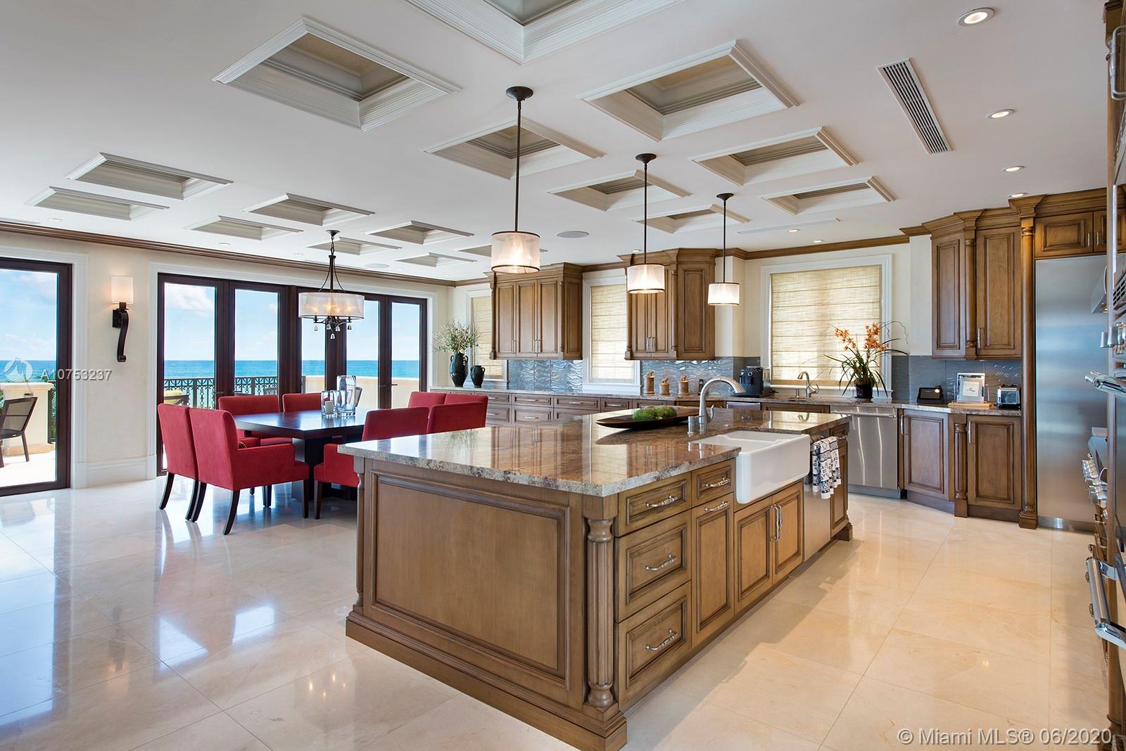 7825 Atlantic Way Miami Beach, FL 33141 - Photo 18 of 38 a kitchen with kitchen island granite countertop lots of counter top space