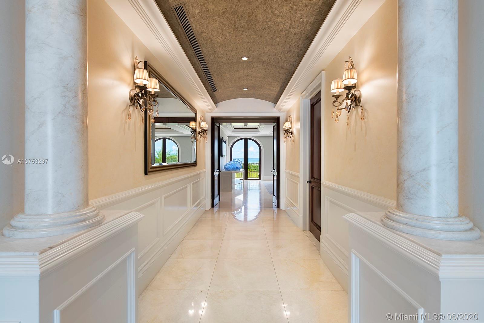 7825 Atlantic Way Miami Beach, FL 33141 - Photo 21 of 38 a view of a hallway with windows