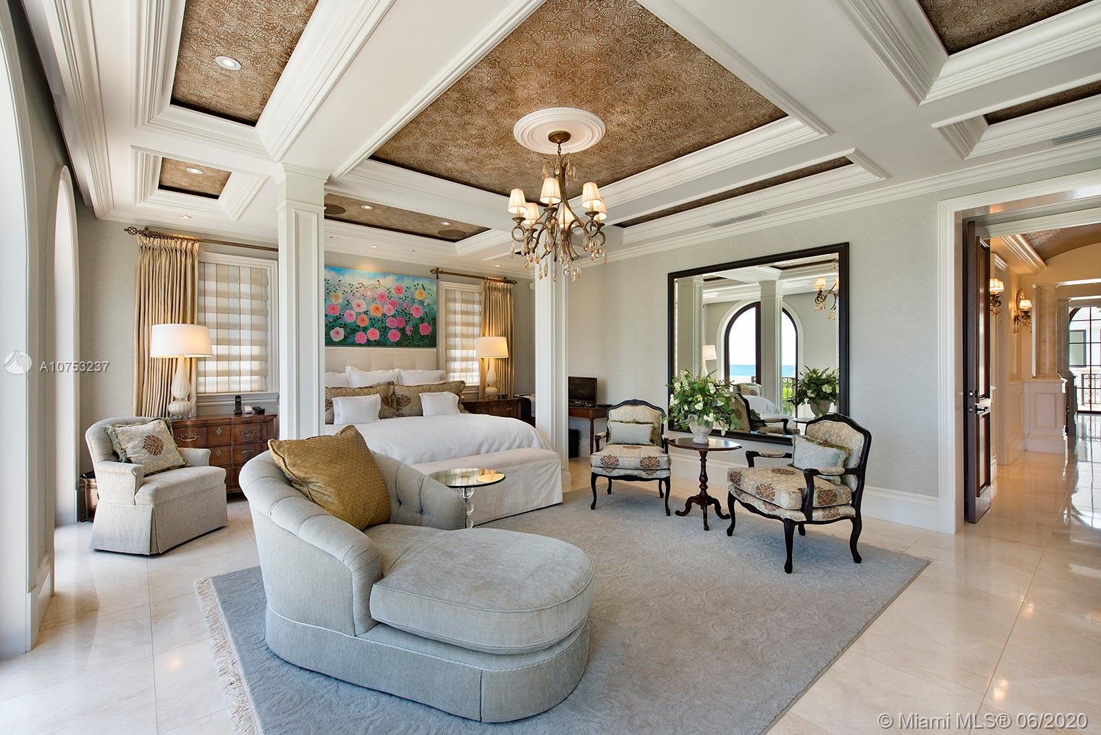 7825 Atlantic Way Miami Beach, FL 33141 - Photo 22 of 38 a living room with furniture and a chandelier