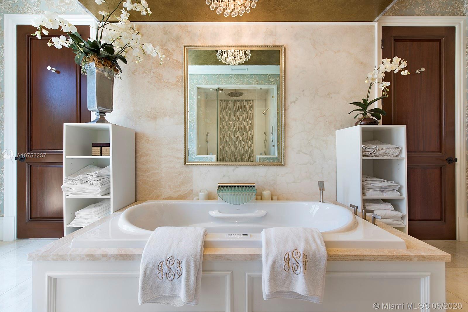 7825 Atlantic Way Miami Beach, FL 33141 - Photo 26 of 38 a dining table with a mirror