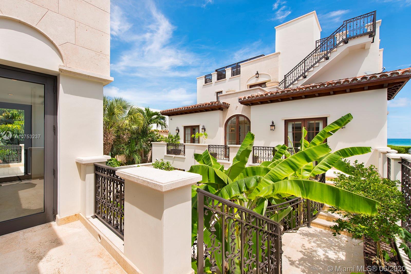 7825 Atlantic Way Miami Beach, FL 33141 - Photo 37 of 38 a front view of a house with garden