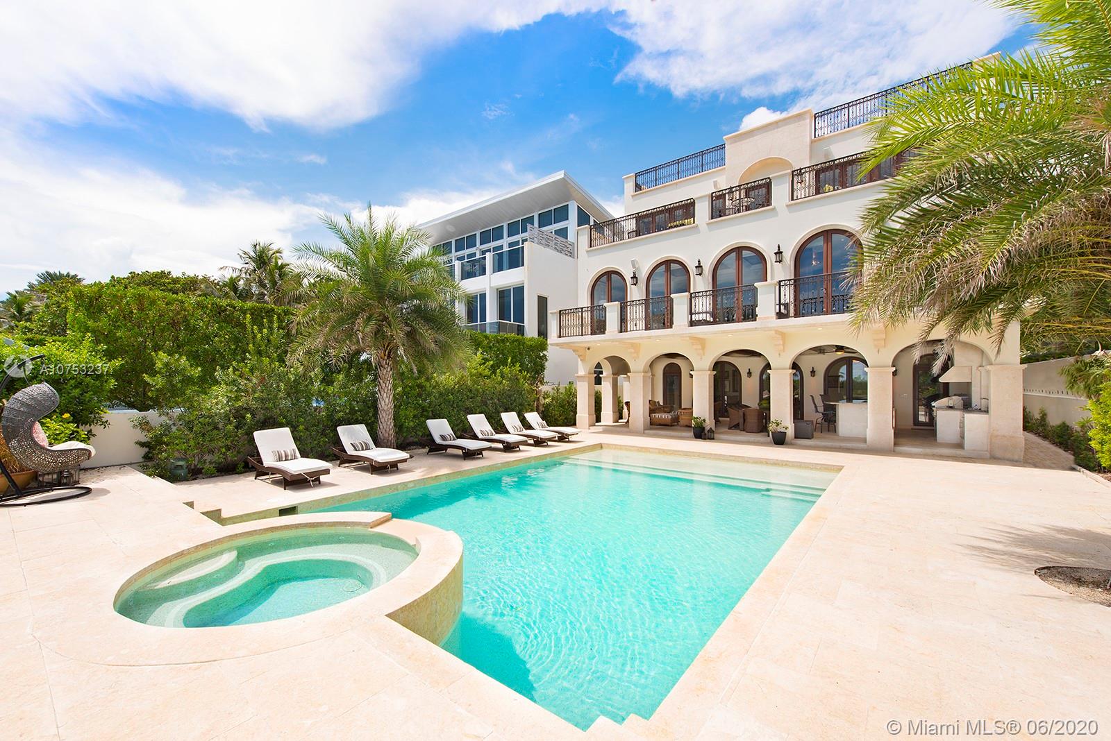 7825 Atlantic Way Miami Beach, FL 33141 - Photo 7 of 38 a swimming pool with outdoor seating and yard