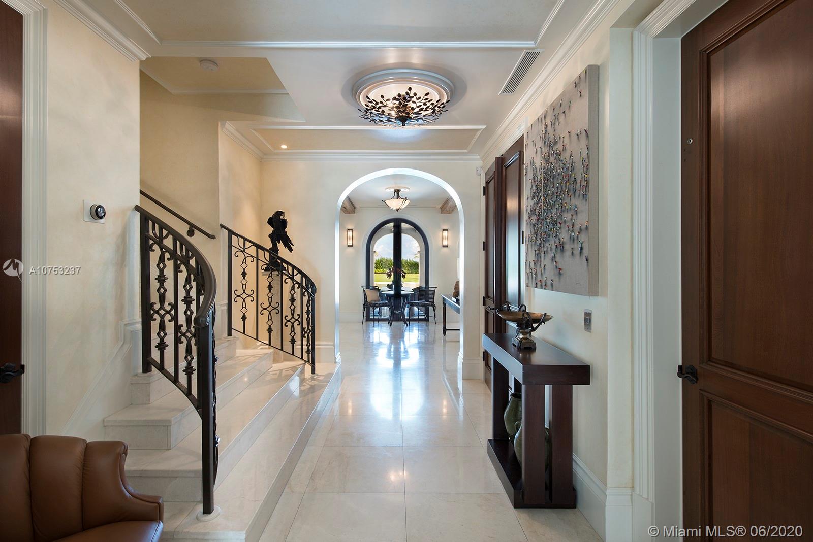 7825 Atlantic Way Miami Beach, FL 33141 - Photo 10 of 38 a view of entryway and hall with wooden floor