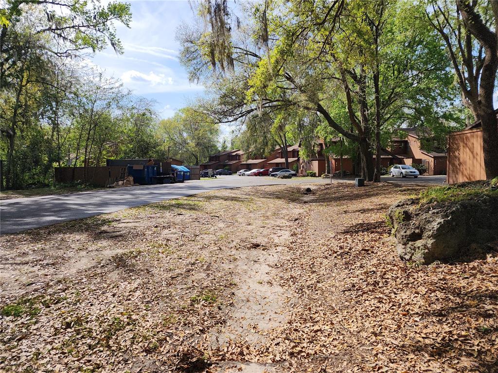 5823 Southwest 9th Place, Unit H55 Gainesville, FL 32607 - Photo 49 of 50 a view of a yard with a tree