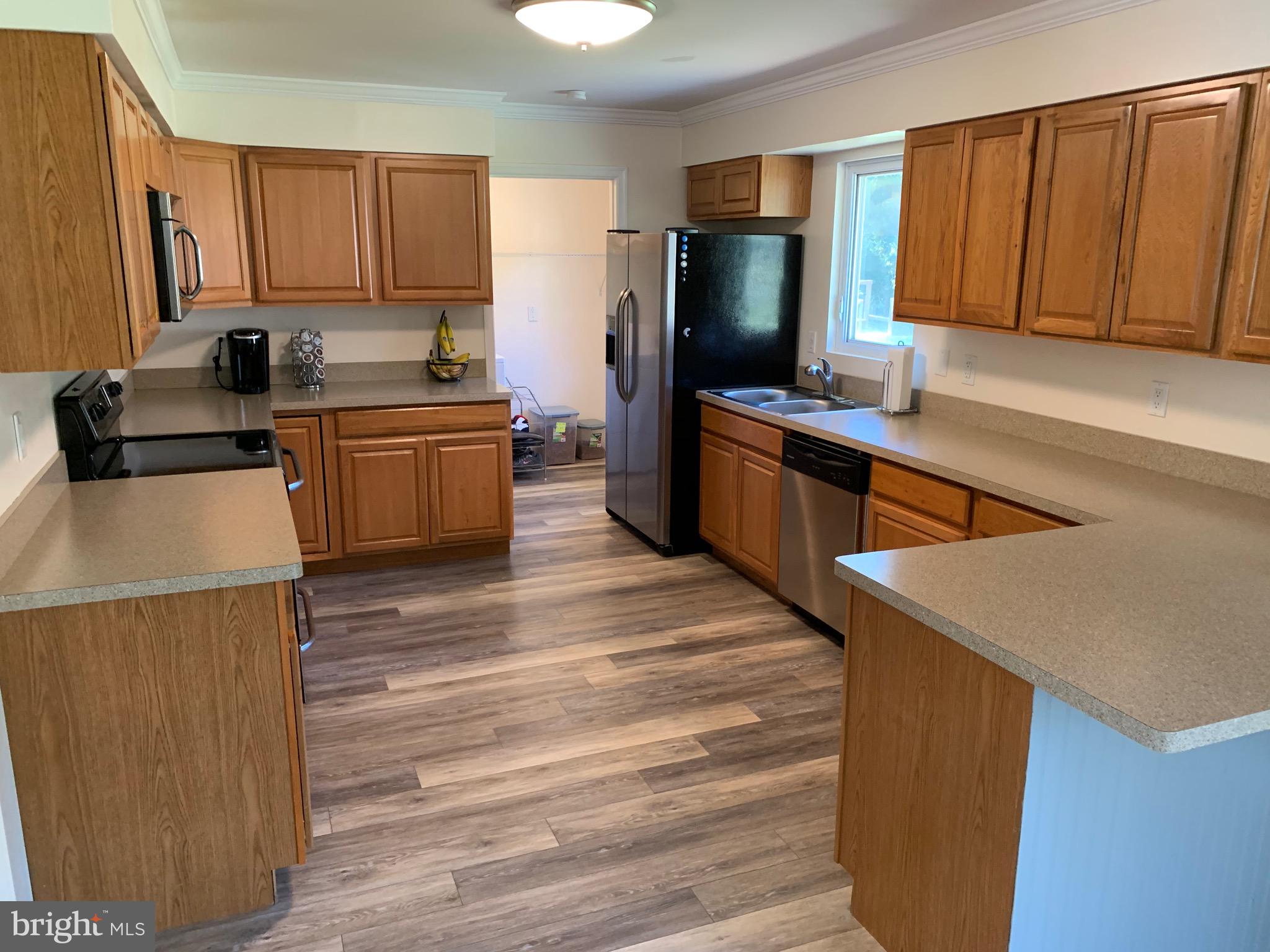23889 Point Lookout Road Leonardtown, MD 20650 - Photo 10 of 20 Kitchen with breakfast bar