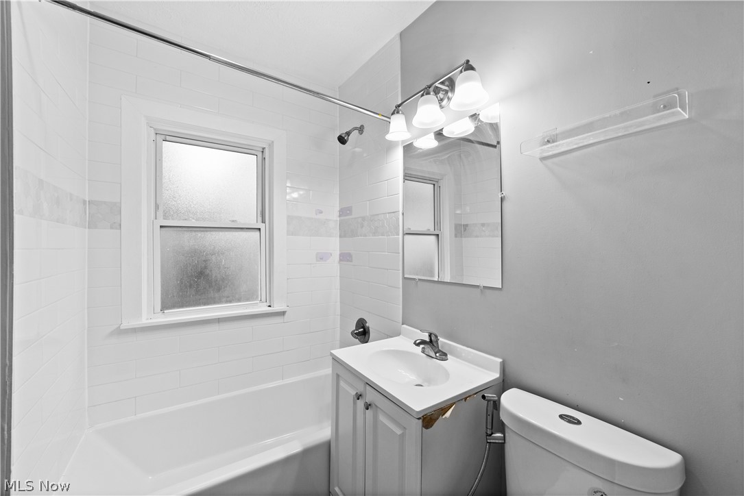 1062 Yellowstone Road Cleveland Heights, OH 44121 - Photo 15 of 29 Full bathroom featuring vanity, tiled shower / bath combo, and toilet