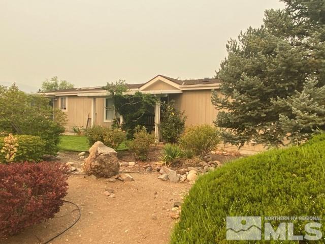 110 Taurus Circle Reno, NV 89521 - Photo 1 of 15 a front view of a house with a yard