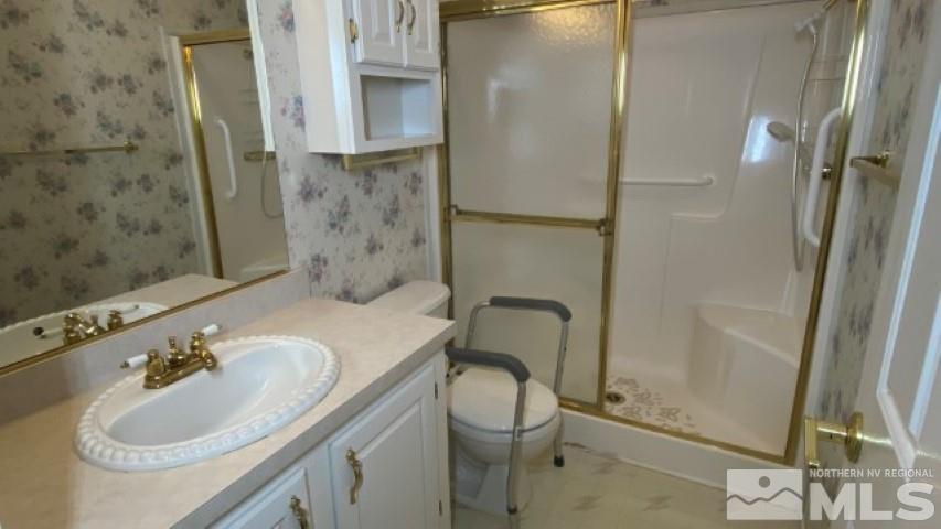 110 Taurus Circle Reno, NV 89521 - Photo 12 of 15 a bathroom with a sink toilet and shower