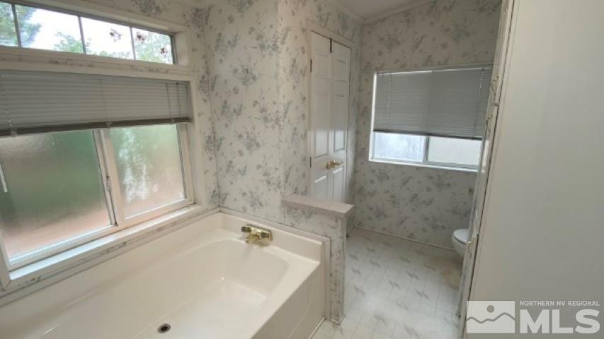 110 Taurus Circle Reno, NV 89521 - Photo 14 of 15 a bathroom with a tub and a shower