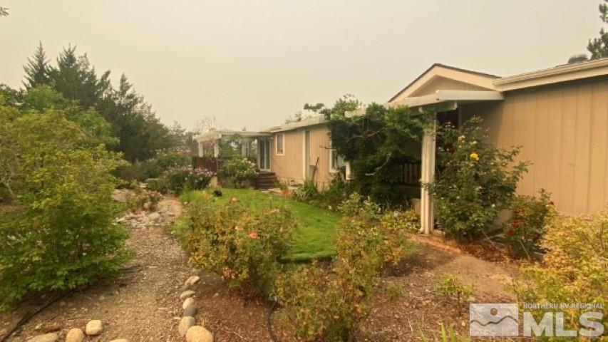 110 Taurus Circle Reno, NV 89521 - Photo 2 of 15 a view of a house with a yard