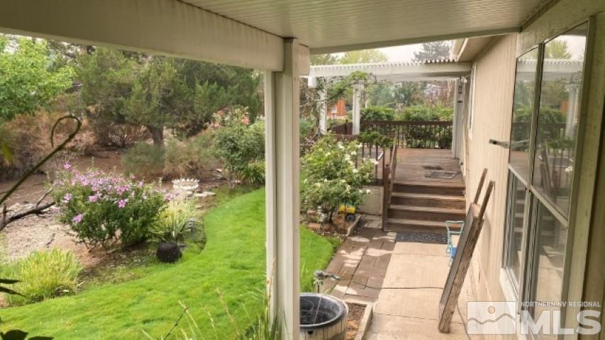 110 Taurus Circle Reno, NV 89521 - Photo 3 of 15 a backyard of a house with yard and outdoor seating