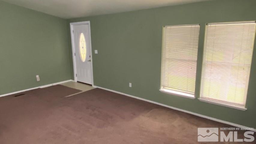 110 Taurus Circle Reno, NV 89521 - Photo 4 of 15 an empty room with windows