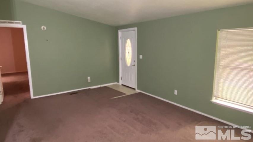 110 Taurus Circle Reno, NV 89521 - Photo 5 of 15 an empty room with windows
