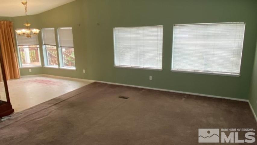 110 Taurus Circle Reno, NV 89521 - Photo 6 of 15 a view of an empty room with a window