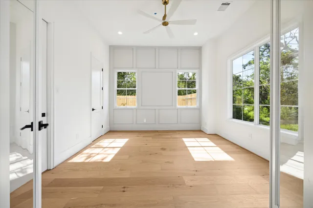 a view of a hallway with windows