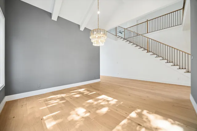a view of an empty room with stairs