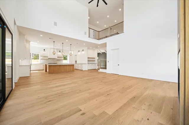 a view of large kitchen with wooden floor