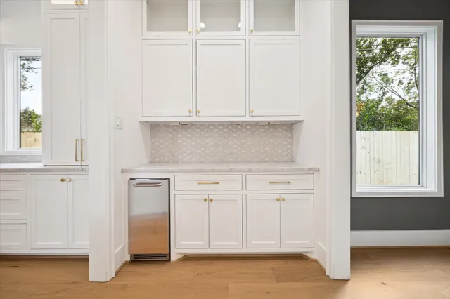 a view of cabinets and window