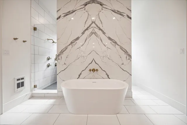 a white bath tub sitting in a bathroom