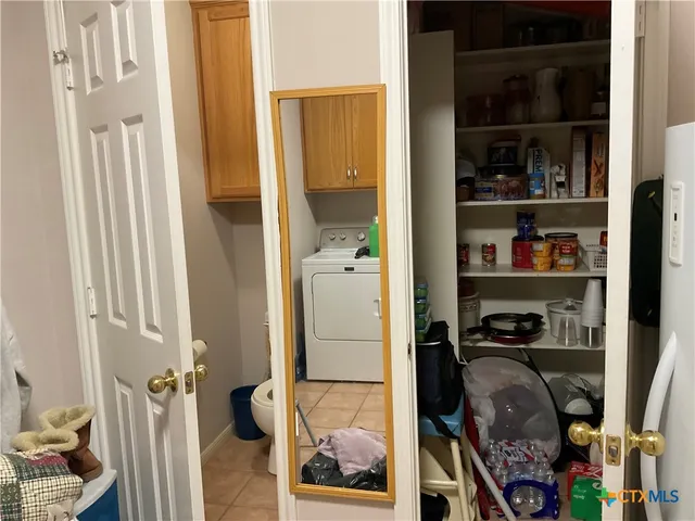 a living room with furniture fireplace and a window