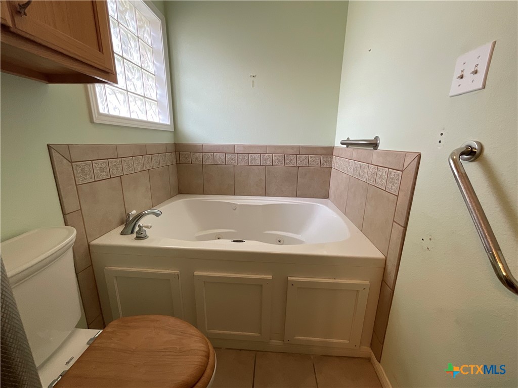 2826 Cattle Guard Road Cuero, TX 77954 - Photo 25 of 48 a bathroom with a sink and a toilet