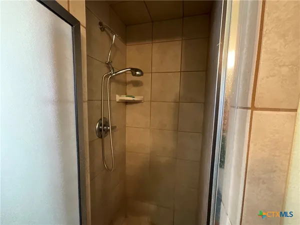 a room with furniture and musical instruments