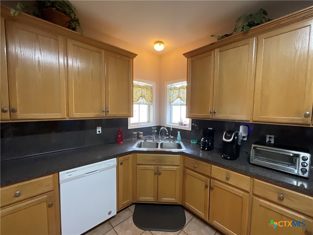 2826 Cattle Guard Road Cuero, TX 77954 - Photo 41 of 48 a kitchen with a sink and cabinets