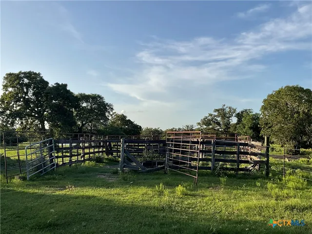 a view of a lake with houses in the back