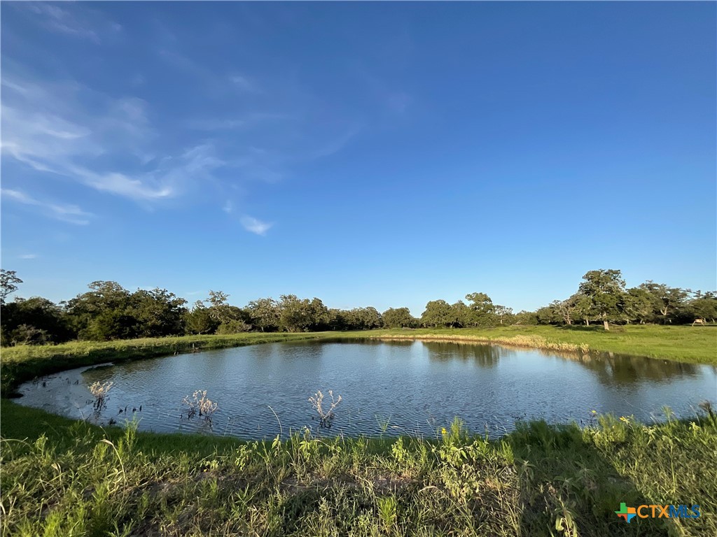 2826 Cattle Guard Road Cuero, TX 77954 - Photo 7 of 33 a view of a lake with houses in the back
