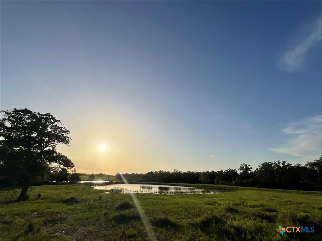 2826 Cattle Guard Road Cuero, TX 77954 - Photo 9 of 33 a view of building with outdoor space and trees