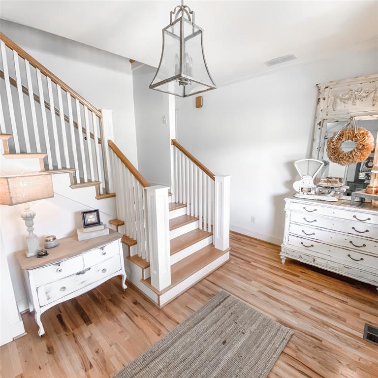 581 Country Club Road Fairview, TX 75069 - Photo 6 of 39 a view of a hallway with wooden floor and staircase