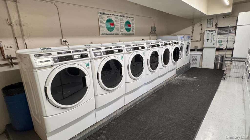 141-05 Pershing Crescent, Unit 416 Queens, NY 11435 - Photo 17 of 17 a utility room with dryer and washer