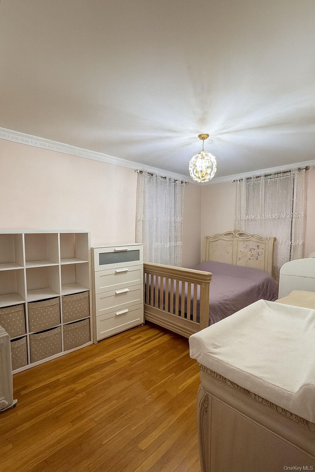 141-05 Pershing Crescent, Unit 416 Queens, NY 11435 - Photo 7 of 17 a view of room with cabinet and windows