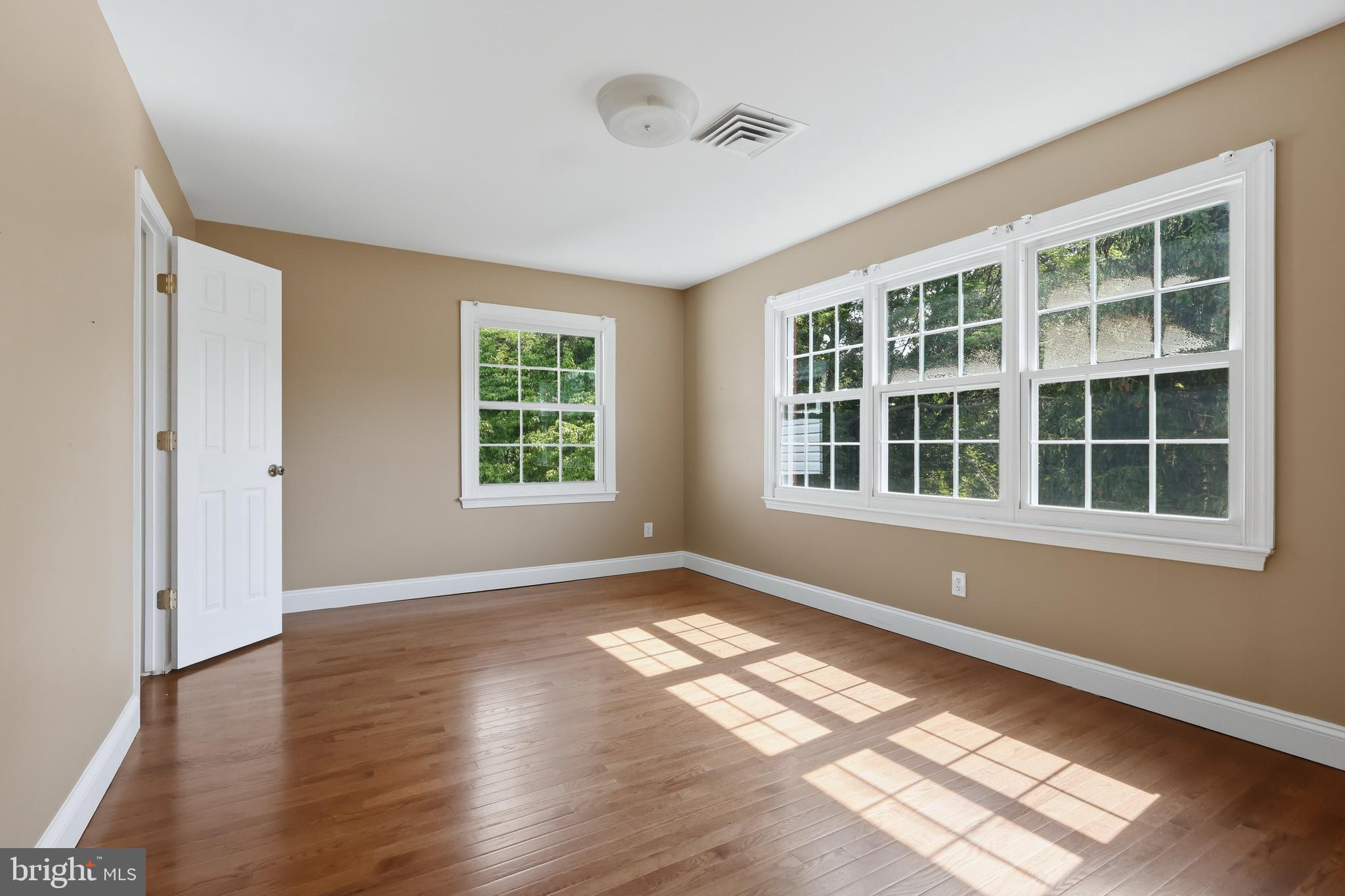 23500 River Road Lexington Park, MD 20653 - Photo 63 of 92 an empty room with wooden floor and windows