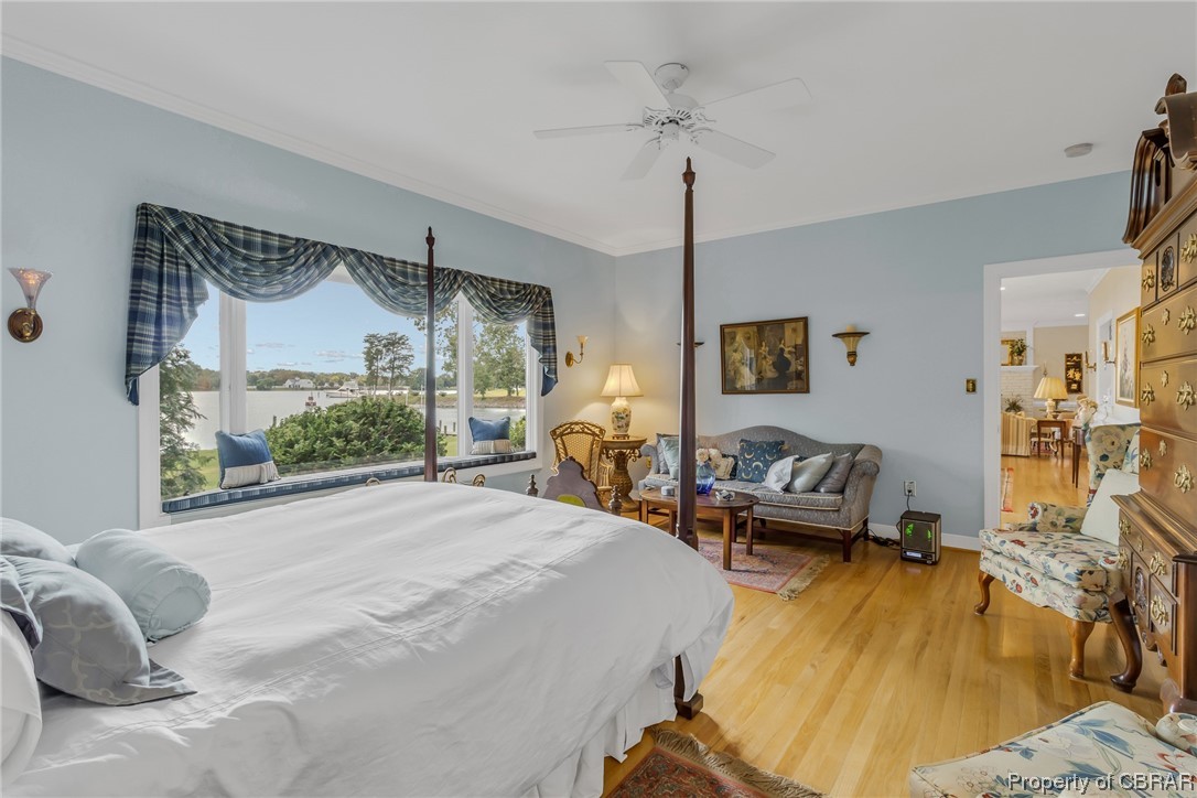 181 Duckbill Road White Stone, VA 22578 - Photo 27 of 50 Hardwood floored bedroom with ornamental molding and ceiling fan