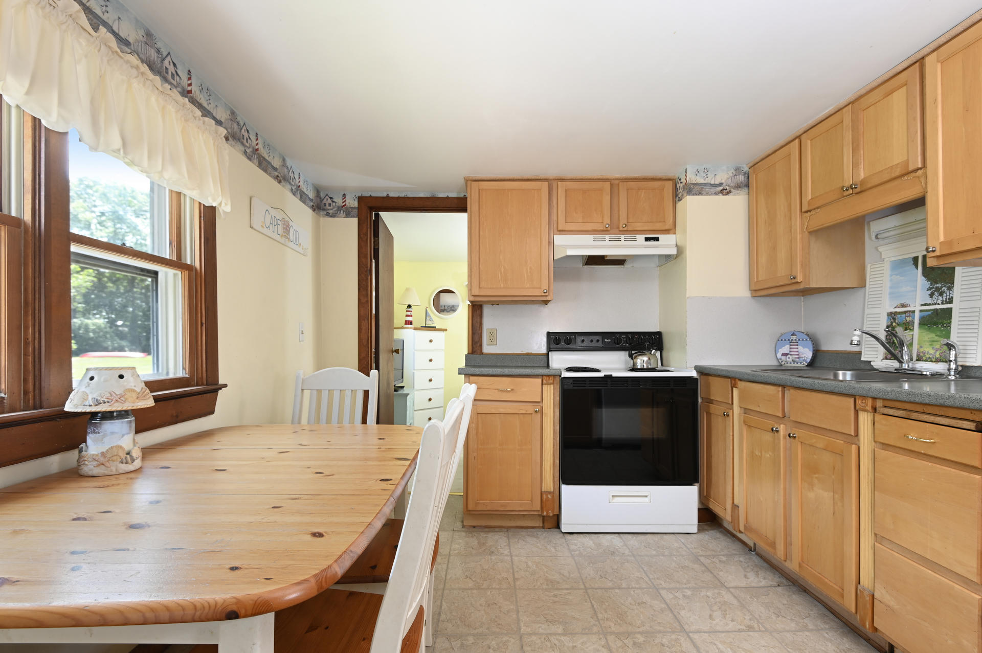 17 Child's Road Mashpee, MA 02649 - Photo 11 of 28 a large kitchen with granite countertop a stove a sink dishwasher and a refrigerator