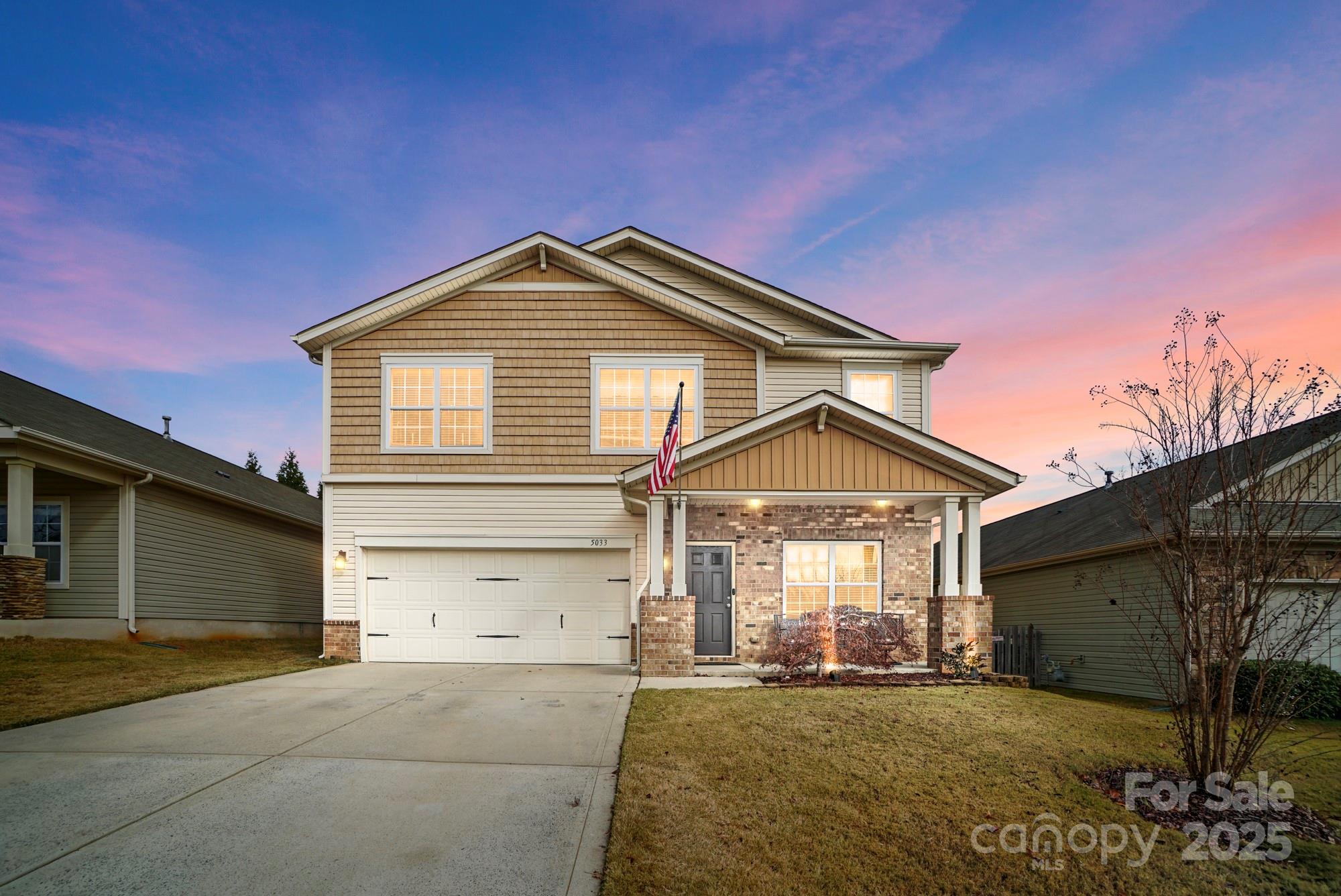 5033 Haven Lodge Road Matthews, NC 28104 - Photo 1 of 37 a front view of a house with a yard