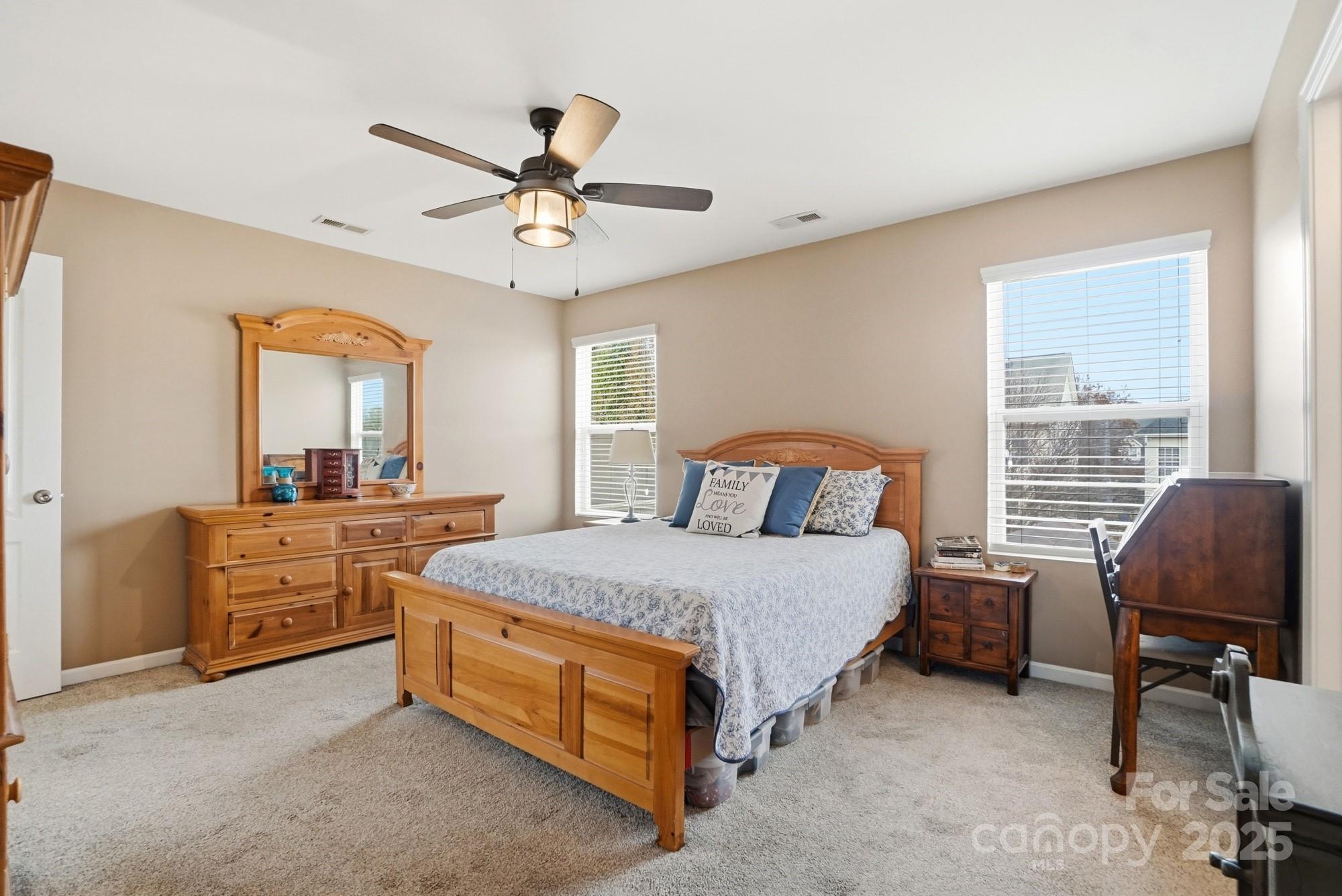 5033 Haven Lodge Road Matthews, NC 28104 - Photo 22 of 37 a bed room with a bed and a chair