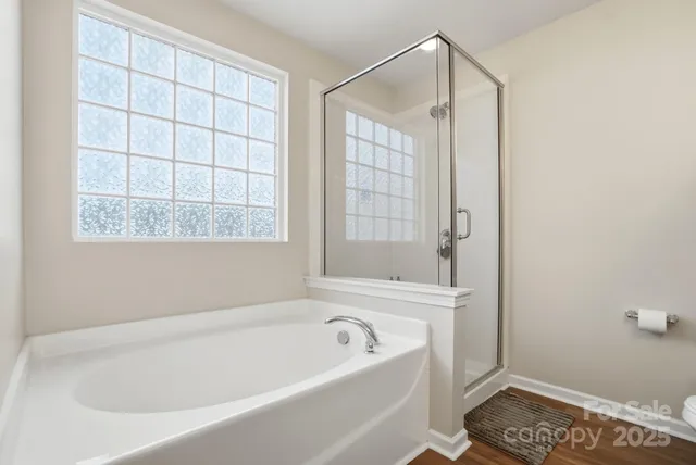 a living room with a bed furniture and a window