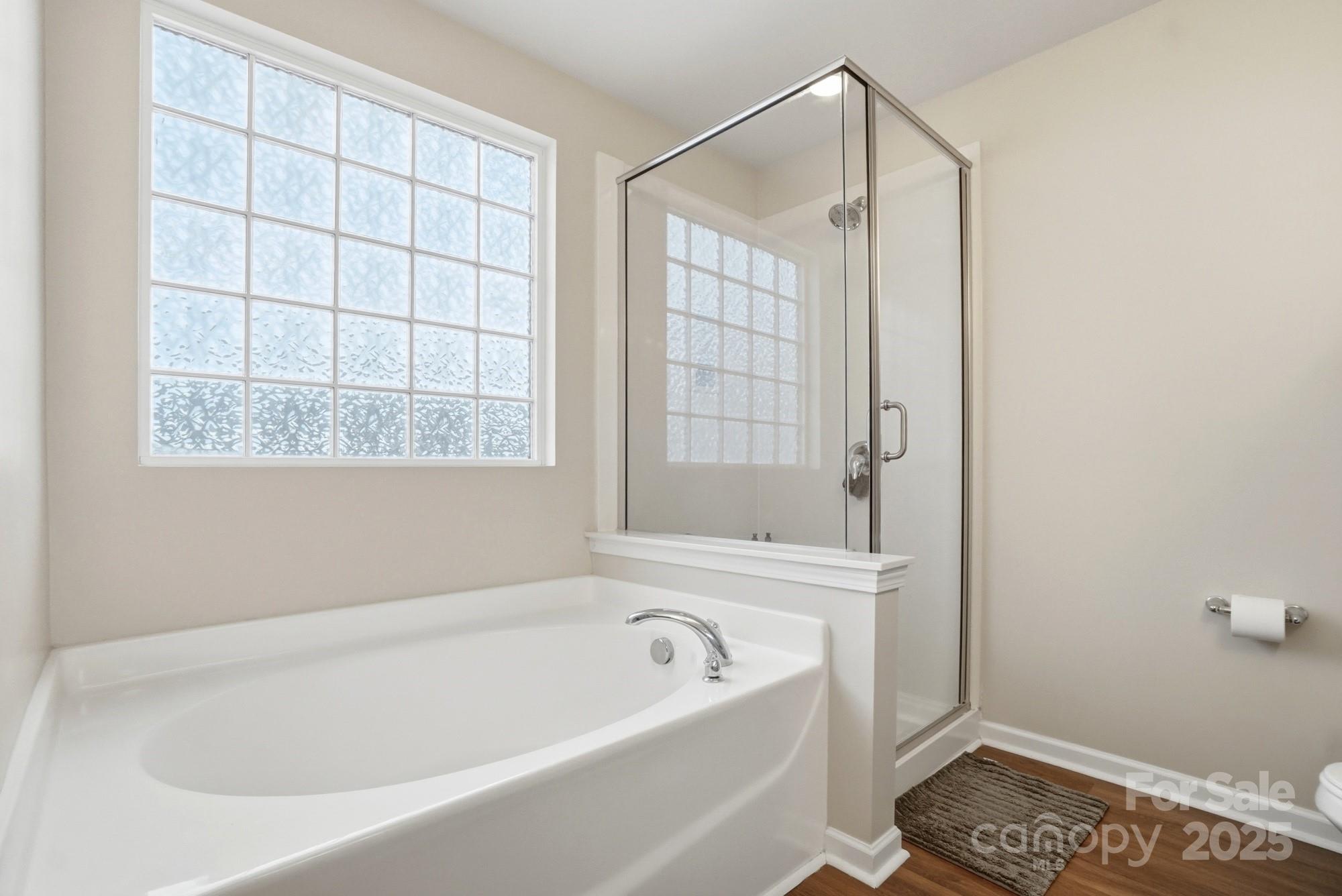 5033 Haven Lodge Road Matthews, NC 28104 - Photo 24 of 37 a bathroom with a bathtub and shower