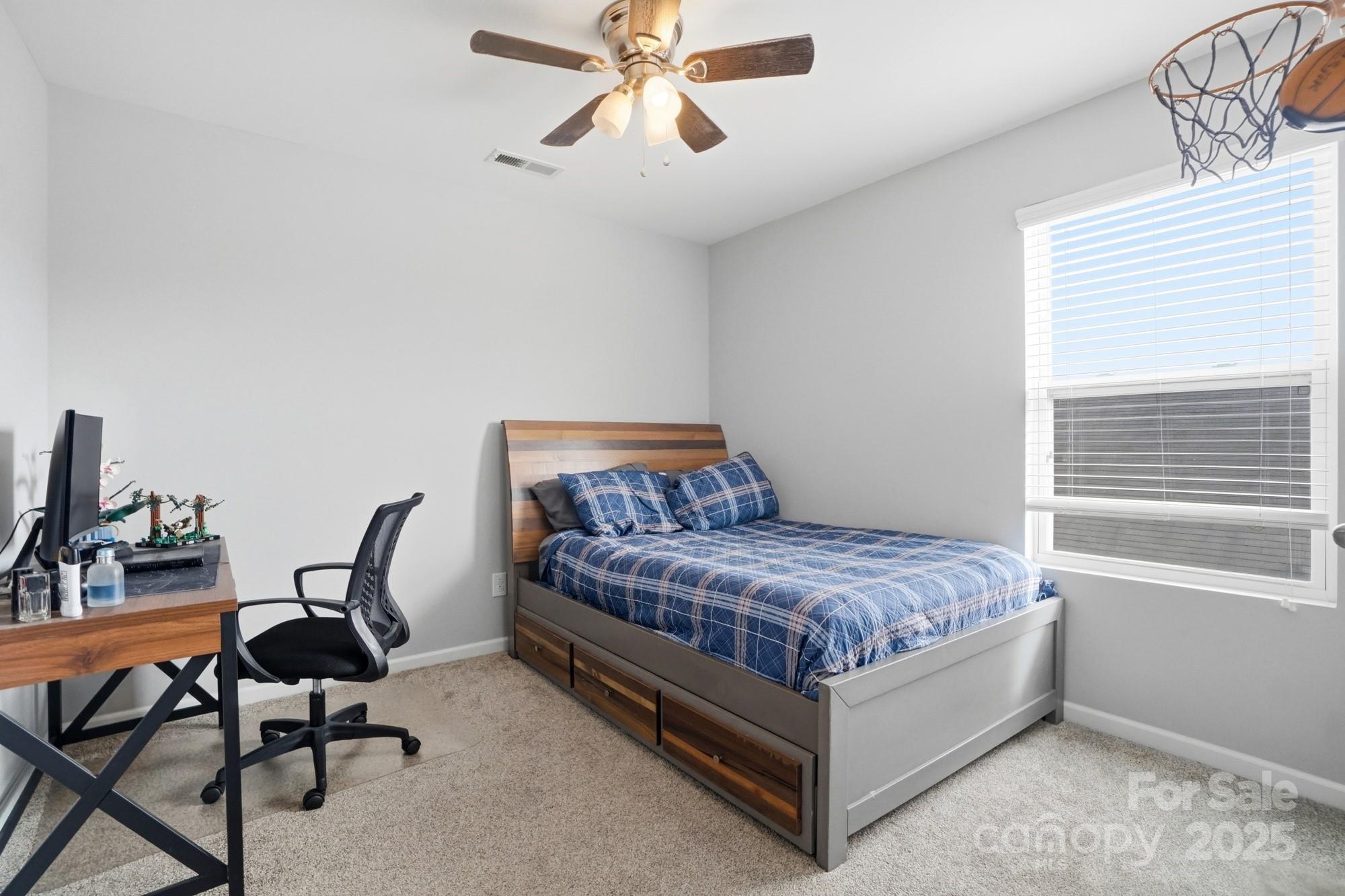 5033 Haven Lodge Road Matthews, NC 28104 - Photo 25 of 37 a living room with a bed furniture and a window